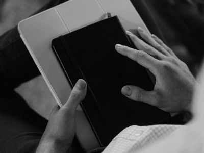 A person's hands clasped together during a moment of calm focus.